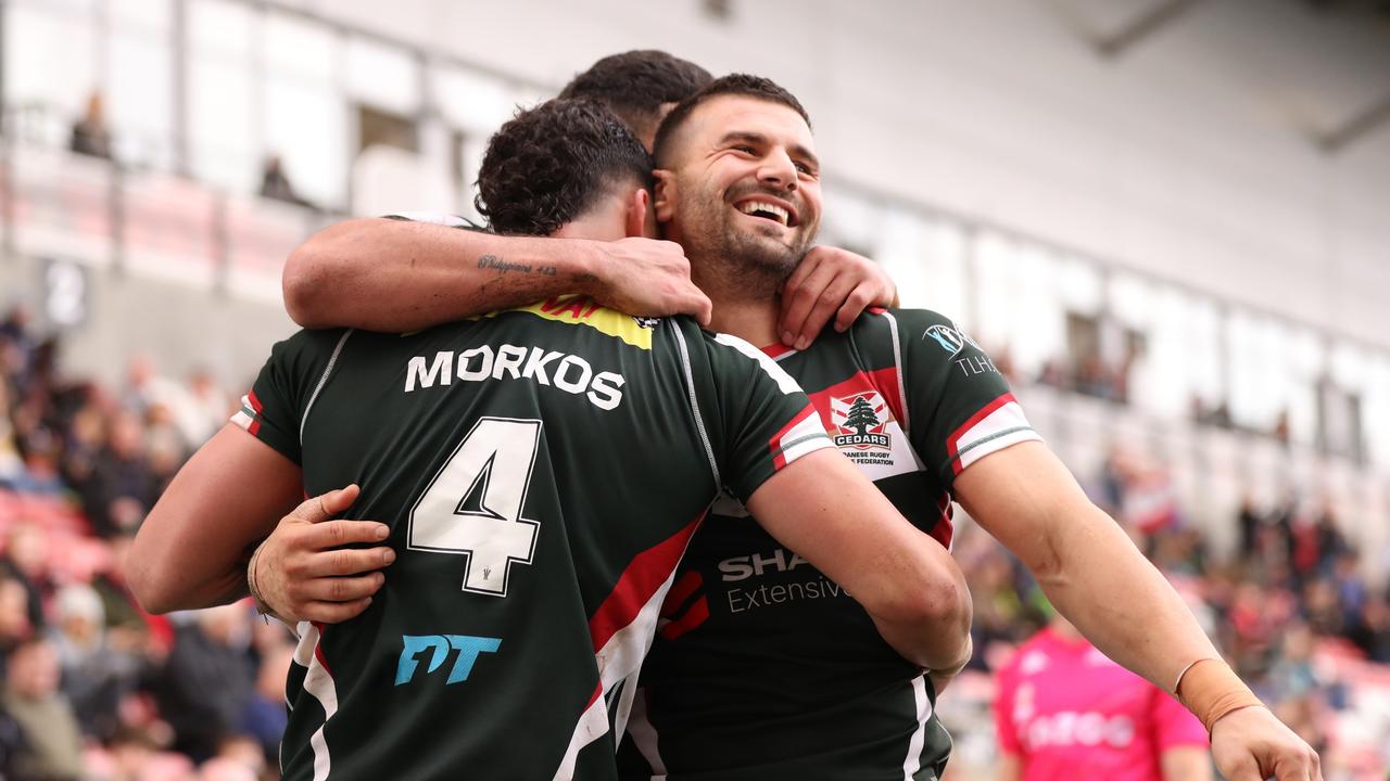 LEIGH, ENGLAND - OCTOBER 30: Josh Mansour of Lebanon celebrates their hat trick try and their sides twelfth try during Rugby League World Cup 2021 Pool C match between Lebanon and Jamaica at Leigh Sports Village on October 30, 2022 in Leigh, England. (Photo by Charlotte Tattersall/Getty Images for RLWC)