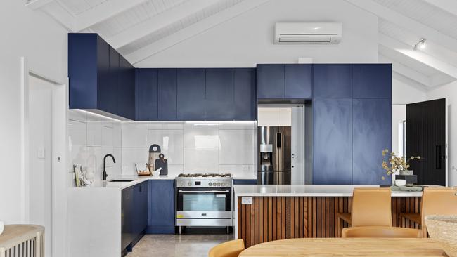 The kitchen is a vision in blue.