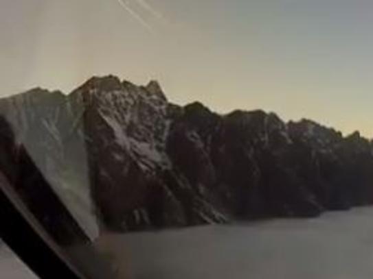The video starts off with stunning snow-capped mountains as the pilot descends in to Queenstown airport.