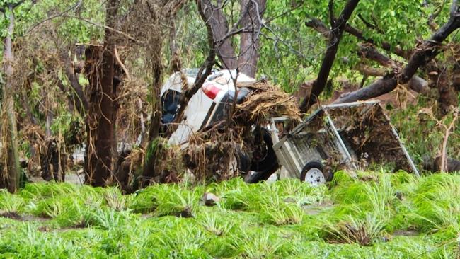 A 74-year-old woman was rescued from floodwaters after her car was washed off a bridge during flash flooding. Picture: Supplied