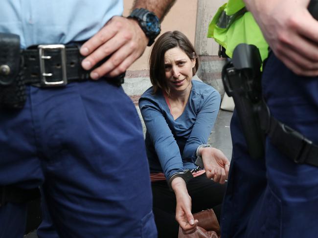 A protester after her arrest at the Spring Rebellion: Take Back the Streets climate and mining protest. Picture: Richard Dobson