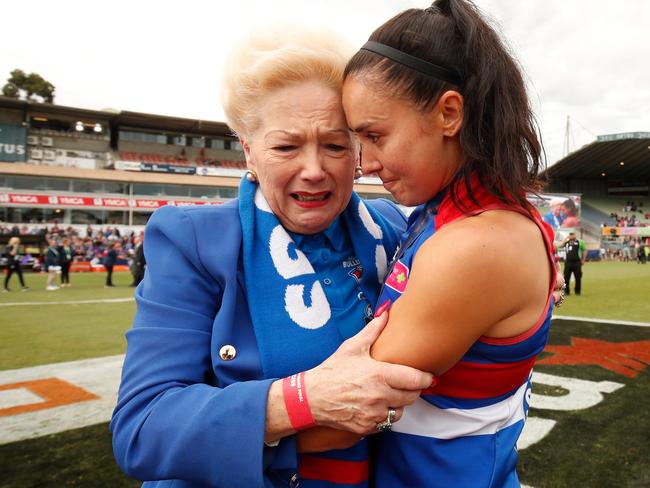 MELBOURNE, AUSTRALIA - MARCH 24: Susan Alberti, Club Legend of the Bulldogs celebrates with Nicole Callinan of the Bulldogs during the 2018 AFLW Grand Final match between the Western Bulldogs and the Brisbane Lions at IKON Park on March 24, 2018 in Melbourne, Australia. (Photo by Adam Trafford/AFL Media/Getty Images)