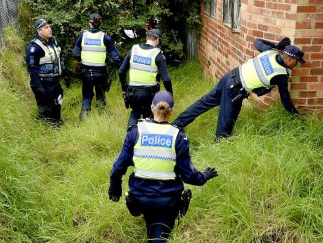 Police search the area after the shooting of Constable Ben Ashmole.