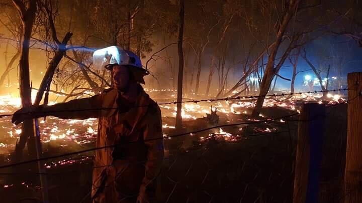 Firefighters battle a blaze in Karara.