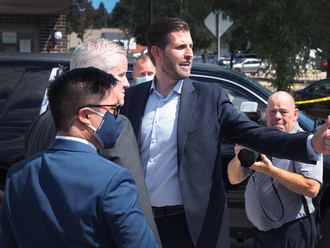 MILWAUKEE, WISCONSIN - AUGUST 18: Eric Trump, the son of President Donald Trump, greets a small number of supporters outside of the Milwaukee Police Association hall where he spoke to about 20 people on August 18, 2020 in Milwaukee, Wisconsin. The visit comes a day after his father visited the nearby city of Oshkosh and on the second day of the Democratic National Convention being held virtually from the Wisconsin Center downtown. The convention, which was once expected to draw 50,000 people to the city, was forced to take place virtually due to coronavirus concerns.   Scott Olson/Getty Images/AFP == FOR NEWSPAPERS, INTERNET, TELCOS & TELEVISION USE ONLY ==