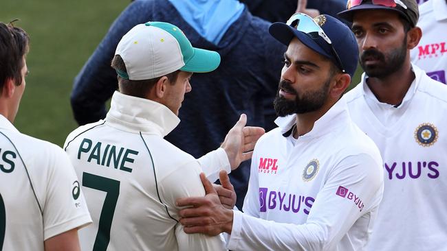 India's captain Virat Kohli congratulates Australia's captain Tim Paine before heading home for the birth of his first child Picture: AFP