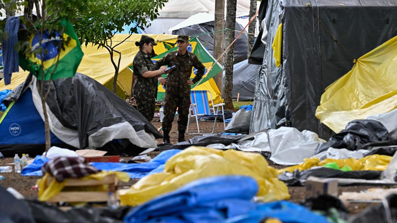 Soldiers dismantle the camp set up by supporters of Brazil's ex-president Jair Bolsonaro in front of the Army headquarters in Brasilia. Picture: AFP