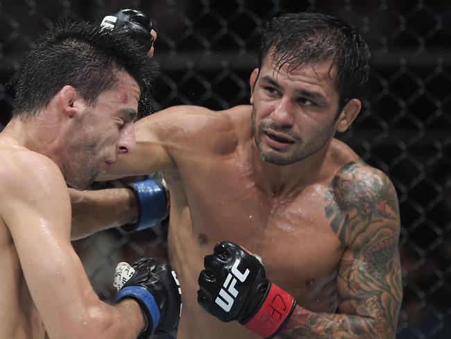 RIO DE JANEIRO, BRAZIL - MAY 04: (R-L) Alexandre Pantoja of Brazil punches Steve Erceg of Australia in a UFC flyweight championship bout during the UFC 301 event at Farmasi Arena on May 04, 2024 in Rio de Janeiro, Brazil.  (Photo by Alexandre Loureiro/Zuffa LLC via Getty Images)