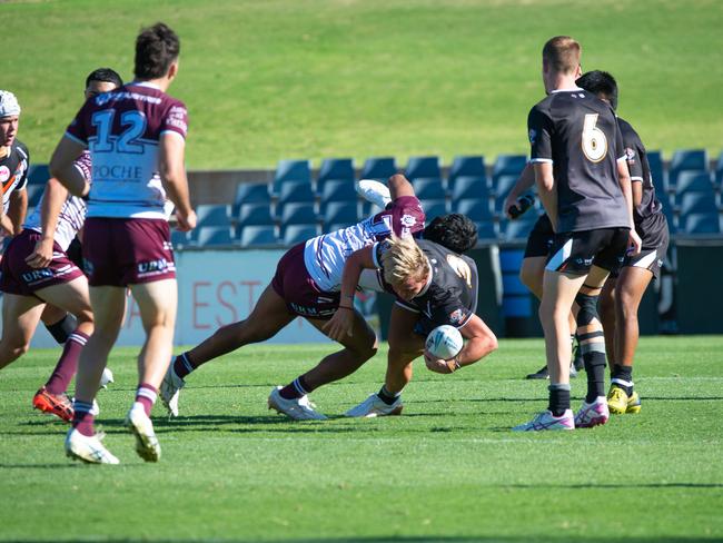 Wiliam Craig is hit hard. Picture: Thomas Lisson