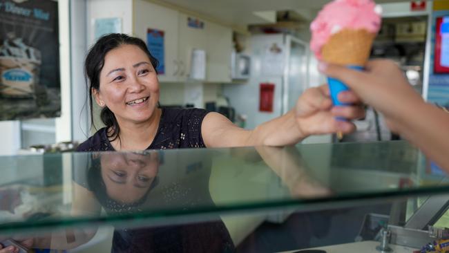 Cold Rock Ice Creamery owner Maya Aing serves from the Aplin St shop on Thursday. Picture: Nuno Avendano