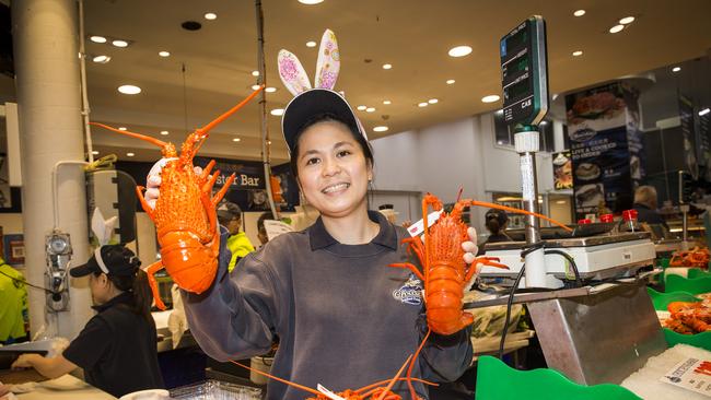 Christie's Seafood worker Paula, with lobsters, rocks some Easter bunny ears. Picture: Dylan Robinson