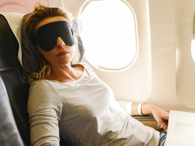 Mature Woman having nap in a plane