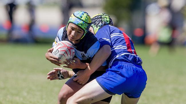 Day One of King of the Country rugby tournament at James Overell Park, Southport. Maroochydore Swans U14s' Andy Bailey in action against USQ Saints U14s (blue white small stripes). Picture: Jerad Williams