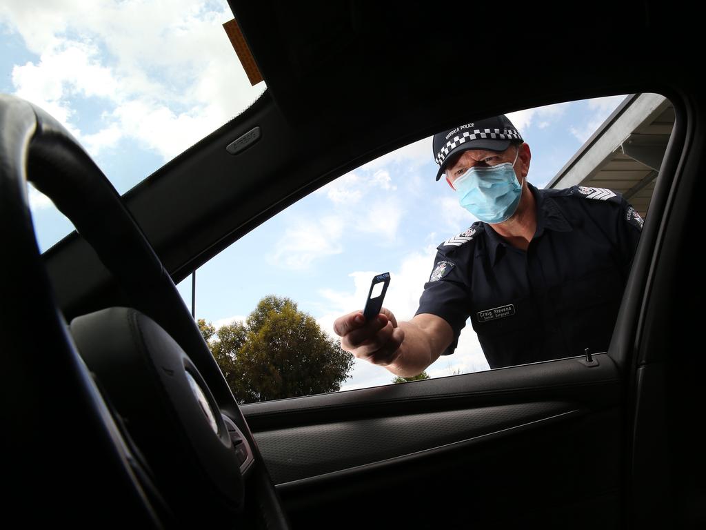 Sen Sgt Craig Stevens with a drug testing kit. Picture: Alison Wynd