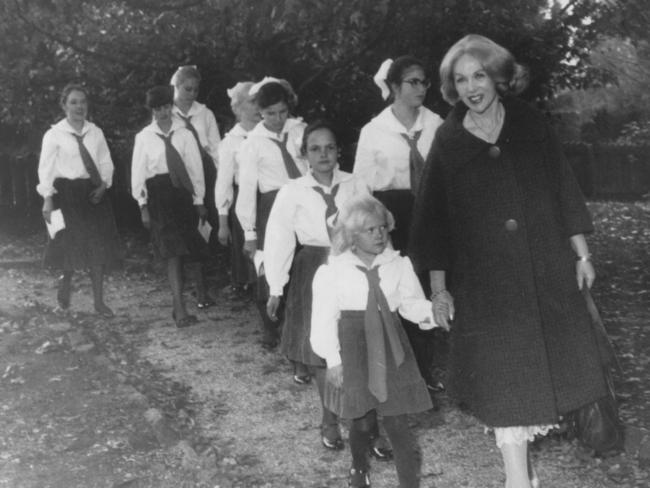 Some of the children take a walk with Anne Hamilton-Byrne. Picture: News Corp