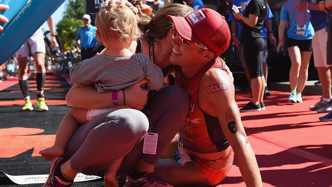 Tim Reed celebrates with his wife and son.