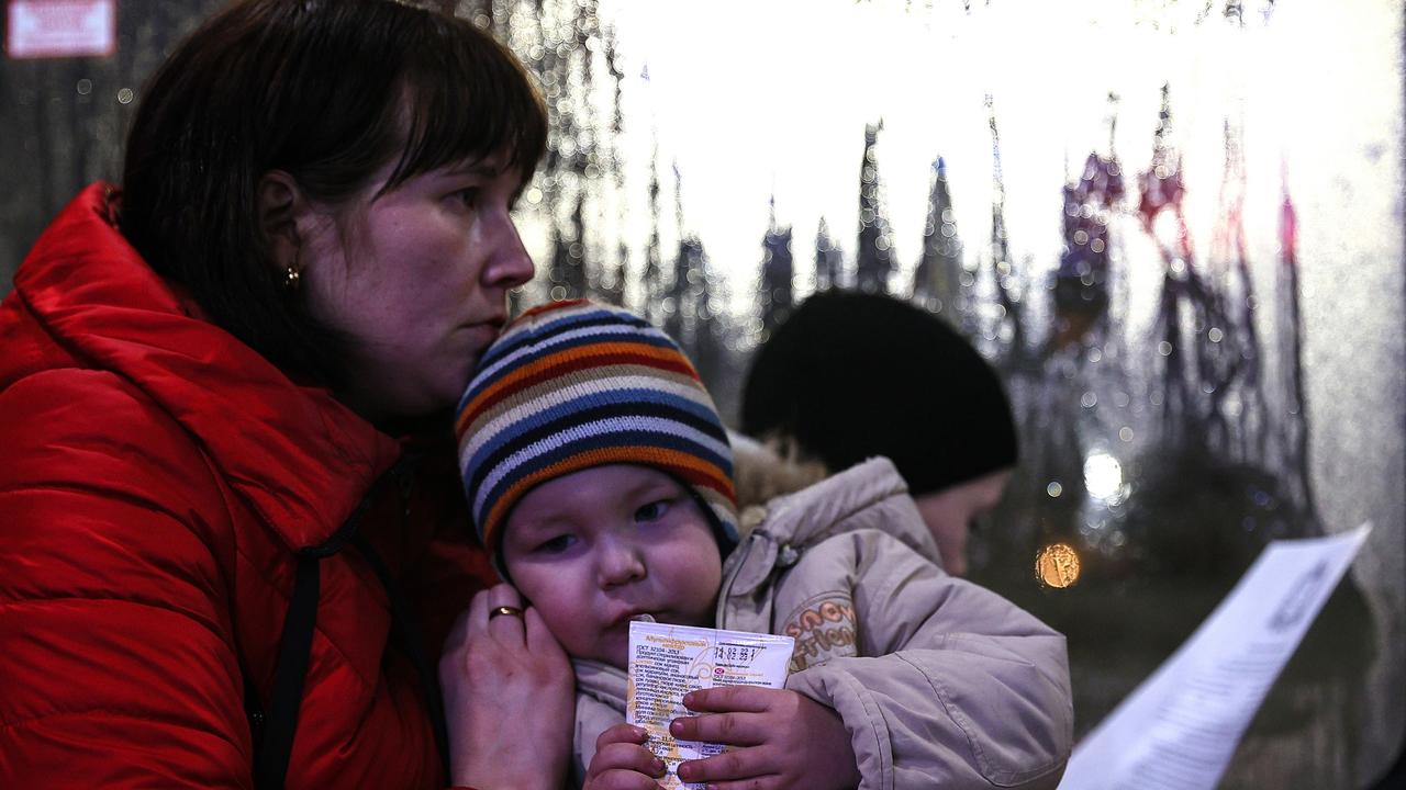 People evacuated from Donbass are seen on a bus at a railway station. As tension escalated in east Ukraine on 18 February, 2022. Picture: Vladimir Smirnov\\TASS via Getty Images.