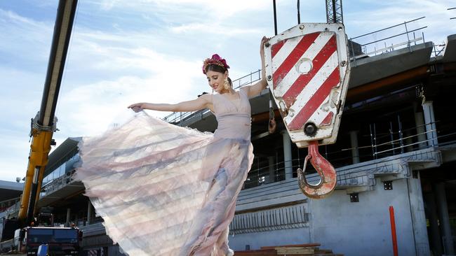 Myer Fashions on the Field ambassador Rebecca Harding wears a Bronx and Banco dress, Mimco headband and Tony Bianco boots in front of the new members’stand. Picture: DAVID CAIRD