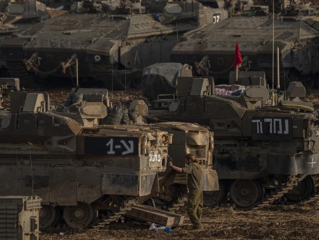 01 October 2024, Israel, Kiryat Shmona: Israeli tanks gather along the Israeli-Lebanese border. The Israeli Defence Forces (IDF) had begun "targeted ground raids based on precise intelligence," the IDF said in a post on social media platform X. "These targets are located in villages close to the border and pose an immediate threat to Israeli communities in northern Israel." Photo: Ilia yefimovich/dpa (Photo by Ilia yefimovich/picture alliance via Getty Images)