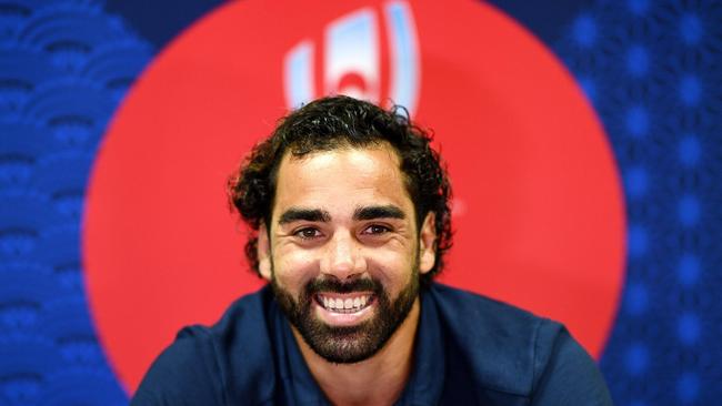 France winger Yoann Huget smiles at a press conference at the Fuji Hokuroku Park.