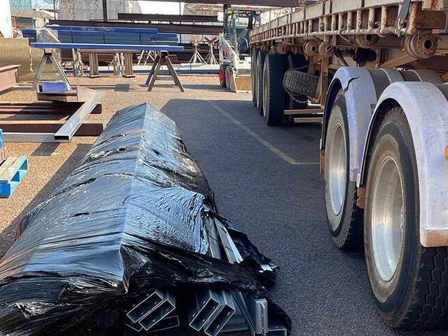 A Darwin subcontractor faces months of rehabilitation after being crushed by a 1.2 tonne bundle of steel beams while standing beside this trailer in late September 2023. Picture: NT Worksafe