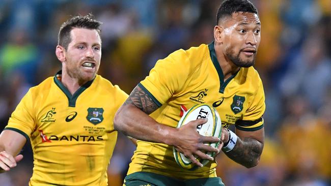 Israel Folau (right) and Bernard Foley (left) playing for the Wallabies last year. Foley said Folau’s social media antics have hurt the Waratahs. Picture: AAP Image/Darren England