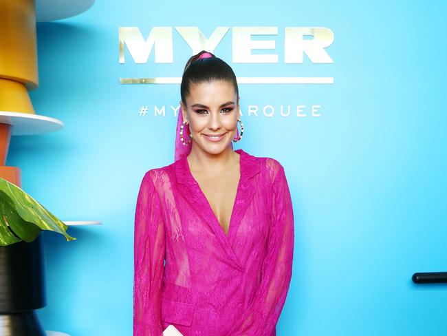 Channel 9 Lauren Phillips in host dazzles in vibrant pink at the Myer marquee in the birdcage at the 2017 Emirates Melbourne Cup. Picture: Aaron Francis