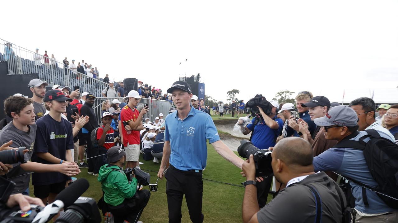 Ryggs Johnston of the United States walks off the 18th green after victory in the Australian Open . (Photo by Darrian Traynor/Getty Images)