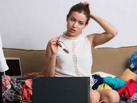 RendezView. Young hipster woman sorting her wardrobe. (Pic: iStock)