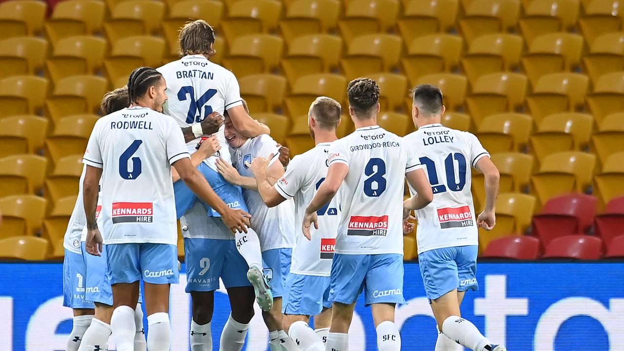 Sydney FC players celebrate one of Fabio Gomes’ two goals in Brisbane. Picture: Albert Perez/Getty Images