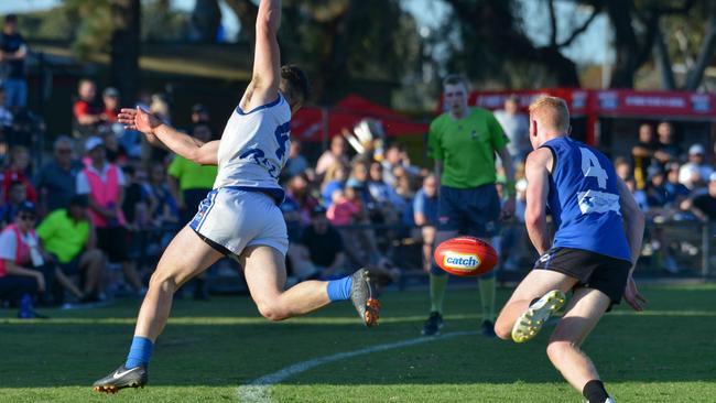 Athelstone’s Josh Schinella tries to keep the ball in during last year’s division two grand final. A last possession out of bounds rule will be trialled this pre-season. Picture: Brenton Edwards