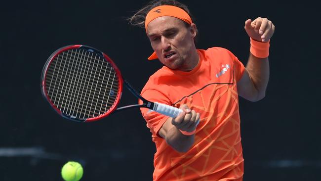 Alexandr Dolgopolov hits a return against Andreas Haider-Maurer during their first-round match. Picture: AFP