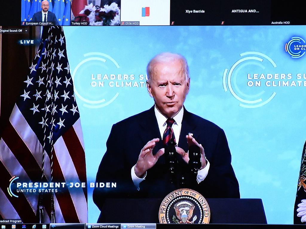 US President Joe Biden is seen on the screen as he attends the leaders summit on climate via video conference, in Brussels. Picture: AFP