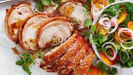 Rolled pork loin with peach and watercress salad.