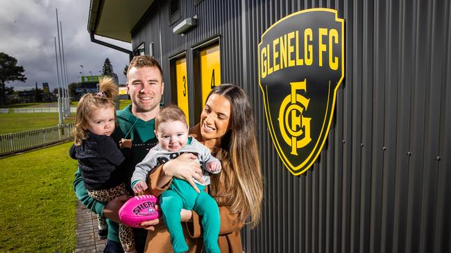 Former Glenelg player and new Prince Alfred OC recruit Andrew Bradley with wife Jordana and two young children Isabelle and Oliver. Picture: Tom Huntley