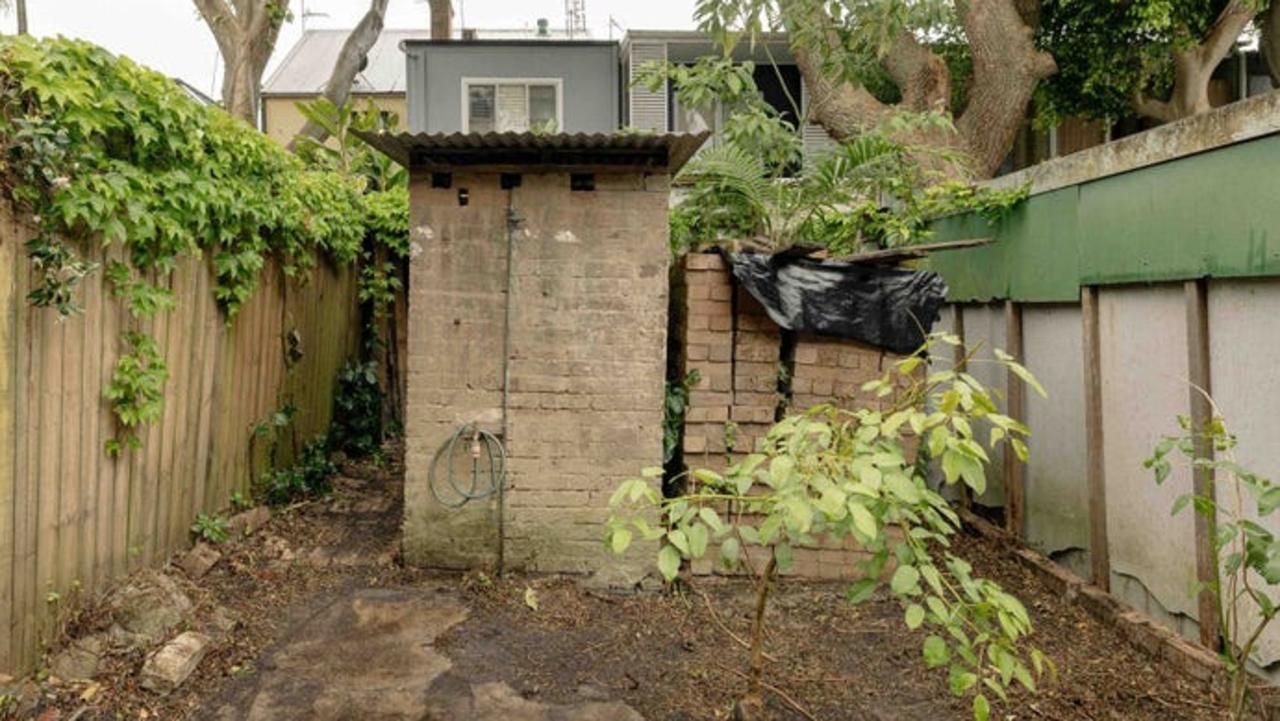 There‘s already a toilet bowl sans walls in the “master suite”, though here’s the outdoor dunny for a more private moment.