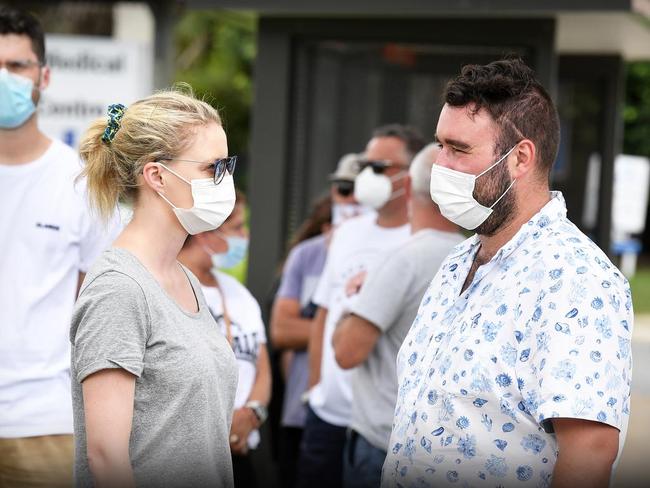 Kirsty Dempsey and Jean-Luke Desmarais line-up for COVID-19 testing outside Buderim Medical Centre. Picture: Patrick Woods.