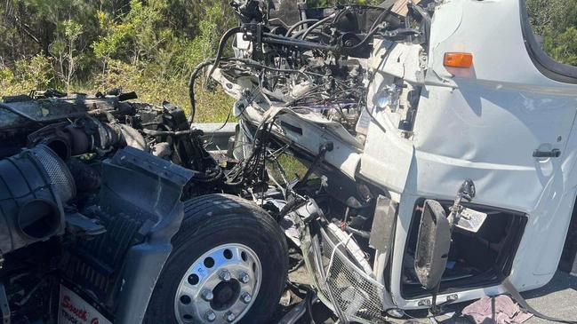 Two people were rushed to hospital in serious conditions after two trucks collided on the Bruce Hwy at Corbould Park on Friday morning, resulting in a spill. Photo: Clayton's Towing