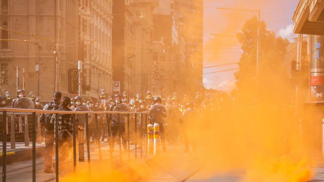 Freedom Rally protesters throw flares. Picture: NCA NewsWire/Sarah Matray