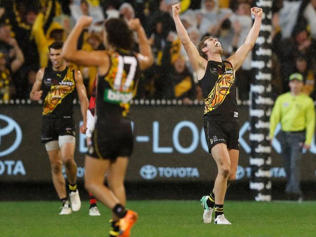 MELBOURNE, AUSTRALIA - MAY 27: David Astbury of the Tigers celebrates on the final siren during the 2017 AFL round 10 Dreamtime at the G match between the Richmond Tigers and the Essendon Bombers at the Melbourne Cricket Ground on May 27, 2017 in Melbourne, Australia. (Photo by Adam Trafford/AFL Media/Getty Images)