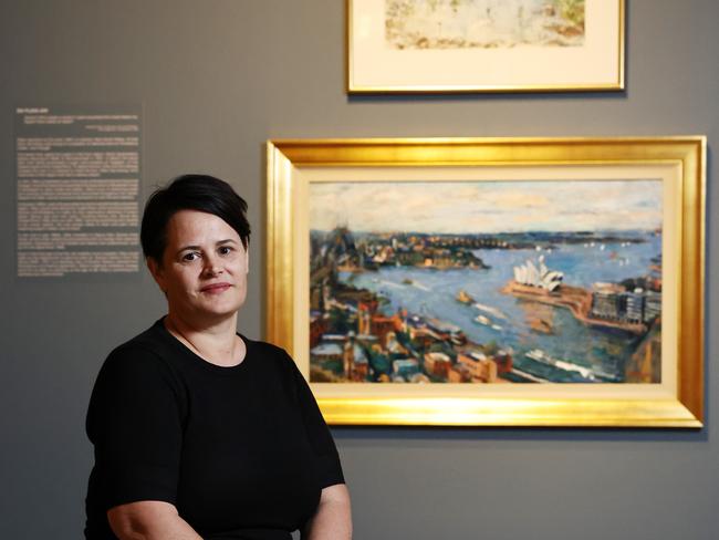 Cairns Art Gallery is currently displaying an exhibition of renowned Australian artist Margaret Olley, with dozens of works on loan from the Tweed Regional Gallery. Cairns Art Gallery manager Kelly Jaunzems admires the Margaret Olley: A Life in Art exhibtion, which is on display until December 8. Picture: Brendan Radke