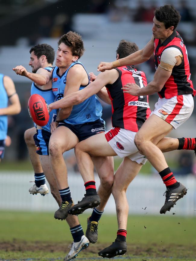 West's Tom Keough and Chris Burgess in a crunch with Sturt's Hugo Munn and Matt Crocker.. Picture: Dean Martin/AAP