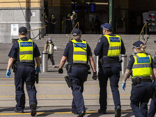 MELBOURNE, AUSTRALIA - NewsWire Photos October 01, 2021:  A Police presences is seen at Flinders Street Station in Melbourne, Victoria. Picture: NCA NewsWire / Daniel Pockett