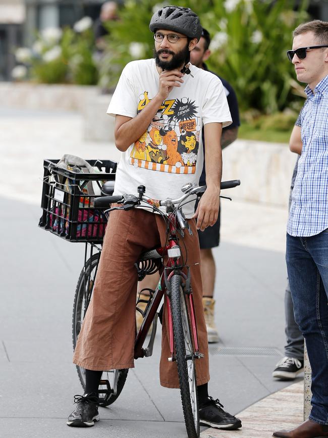 Gabba ward councillor Jonathan Sri on his untethered bike. Picture: AAP