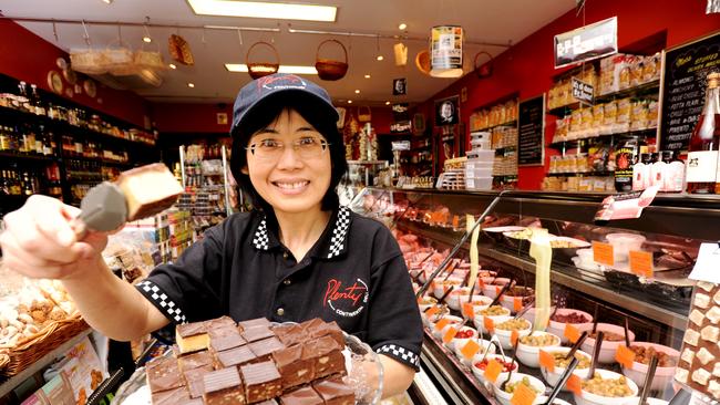 plains DH212652 LVSL Eight Mile Plains shopping centre, Christine Cheong with sweet offerings at Plenty Continental.