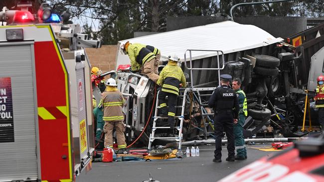 Emergergency services on the scene at the crash at the bottom of the freeway. Picture: Keryn Stevens