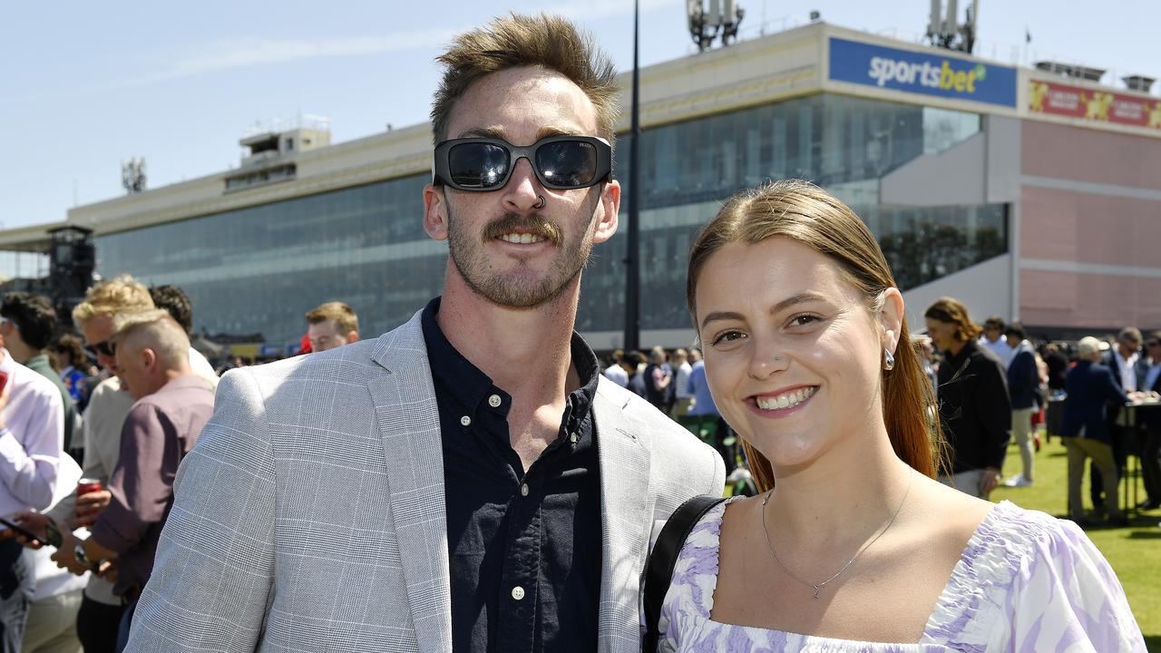 Caulfield Guineas horse race meeting, Caulfield, Victoria, Saturday 12th October 2024. Faces in the crowd. Pictured enjoying the race meeting are Will and Lauren. Picture: Andrew Batsch