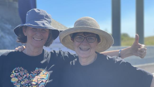 Thea van den Berg and Fiona Herrington, from the Heart of Gold Film Festival, celebrate the impending opening of the Gympie Bypass at a community event on Saturday August 17, 2024.