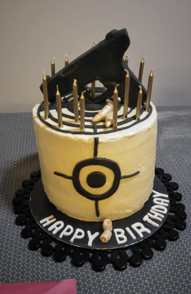 An image from Tyler’s Facebook page shows a birthday cake with what appears to be fondant in the shape of a pistol perched on top of it. Picture: Facebook