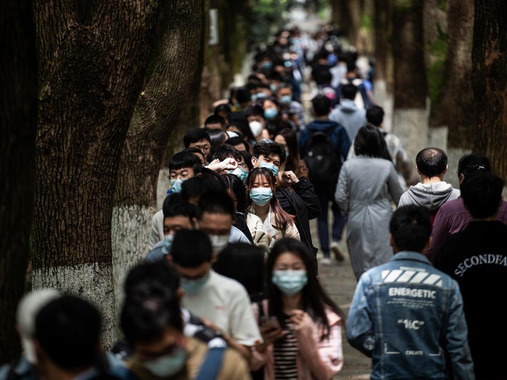 University students queuing to receive the China National Biotec Group (CNBG) vaccine at a university in Wuhan, in China’s central Hubei province. Picture: AFP